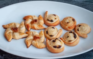 Assorted Danish pastries on a white plate.