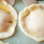 Mini pies brushed with egg wash.
