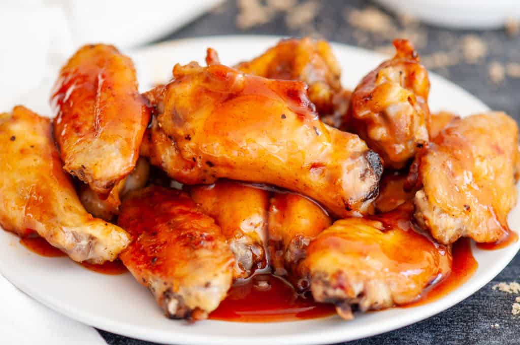 A plate of sriracha glazed chicken wings.