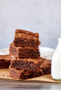 Stack of Cake Mix Brownies with milk.