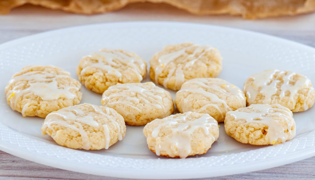 A plate of glazed lemon cream cheese cookies.