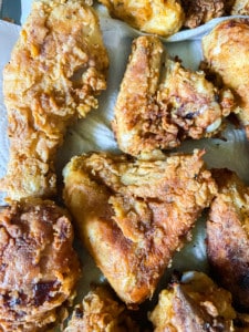 Buttermilk-fried chicken, with the oil drained on tissue paper.