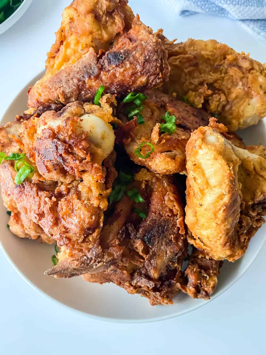 A plate with fried chicken on it.