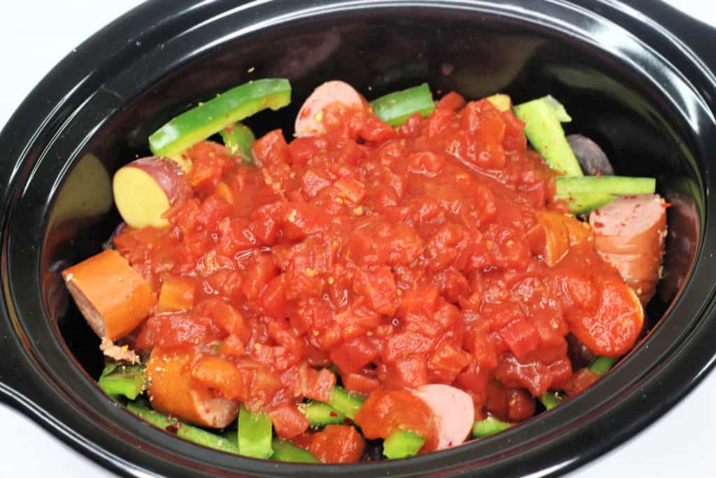 Add sauce to the potatoes and sausage.