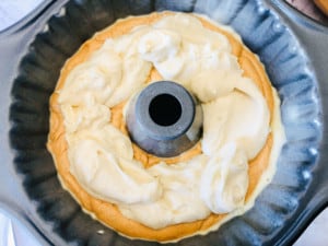 Cream cheese filling on a bundt cake.