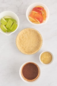 Filling the apple tart.