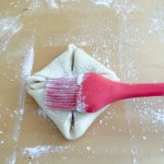 Filo dough folded into a square then dusted.