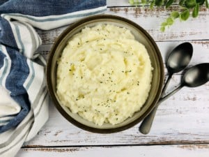 Instant Pot Mashed Potatoes with a parsley garnish.