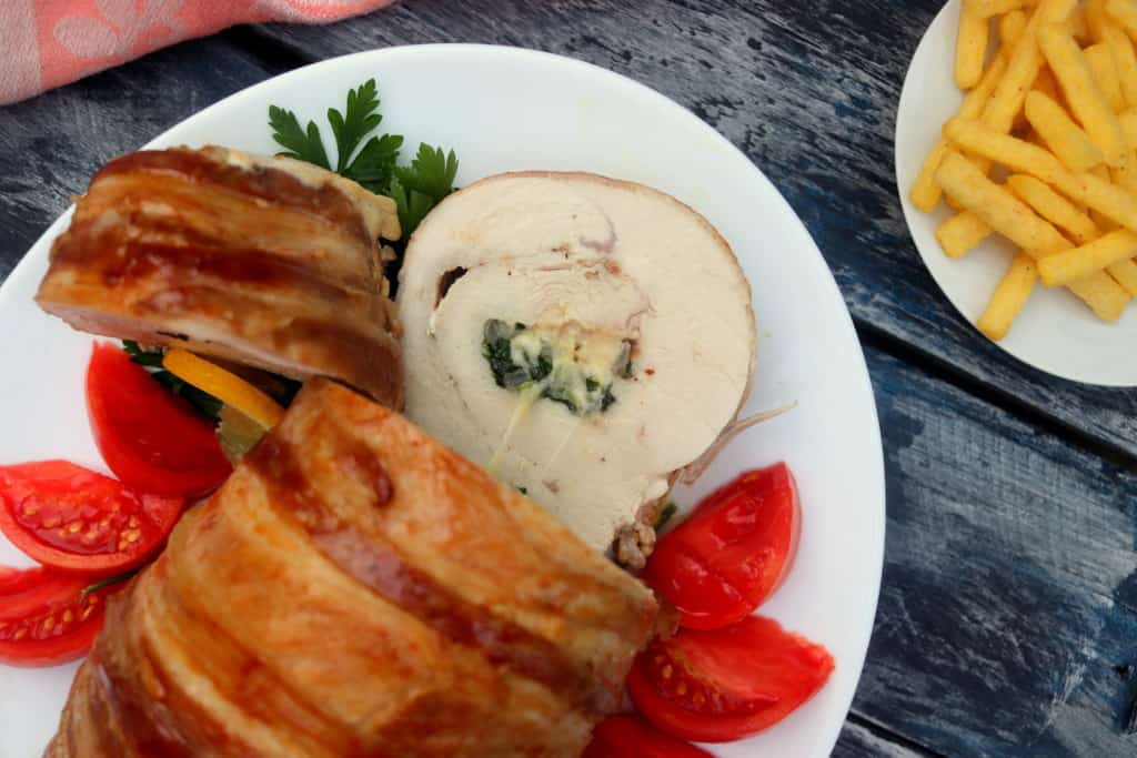 Close-up photo of the sliced Turkey breast showing it's juicy and cheesy insides.