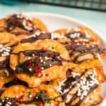 Cookies drizzled with chocolate and sprinkles.