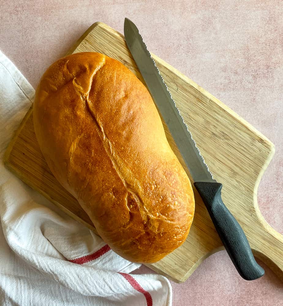 Loaf of bakery bread on a cutting board.