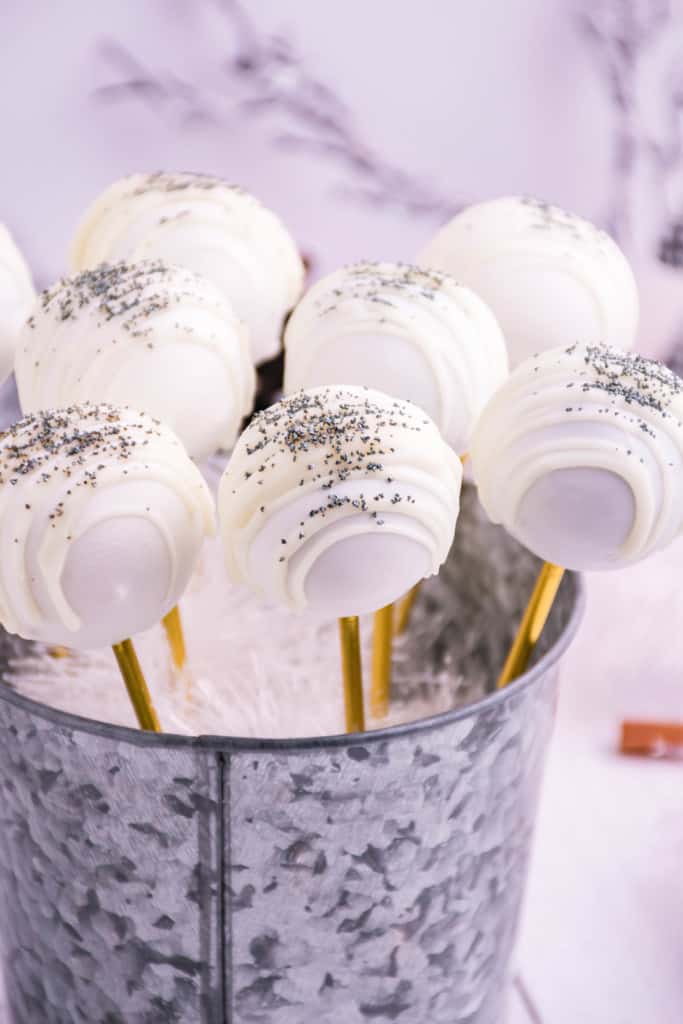 Easter gingerbread cake pops rolled up in vanilla coating drizled with sprinkles.