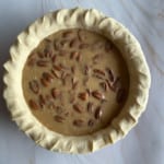 Pecan pumpkin pie before it's baked.