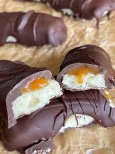 Caramel oozes out of a homemade twix bar.