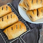 Vegan puff pastry on a plate showing its flaky layers.