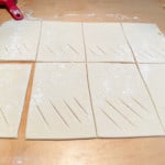 Cut slashes in sausage rolls.