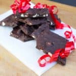 Pieces of dark chocolate bark with nuts.