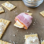 Wrap the bacon around the cracker.