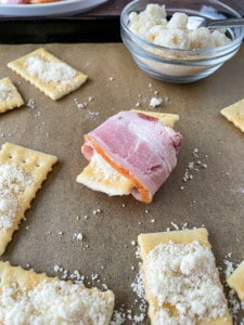 Wrap the bacon around the cracker.