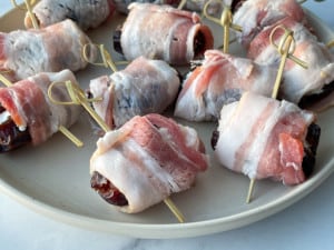Stuffed dates wrapped with bacon ready to be air-fried.