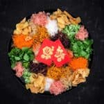A bowl of Yee sang lo sang prosperity salad.