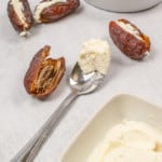 Stuffing dates with goat cheese.