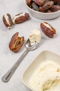 Stuffing dates with goat cheese.