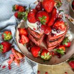 Strawberry pancakes with a ton of fresh strawberries.