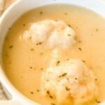 Homemade dumplings in chicken soup.