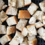 Bread chunks going into the air fryer.