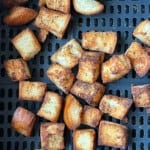 Fresh air fryer croutons still in the basket.