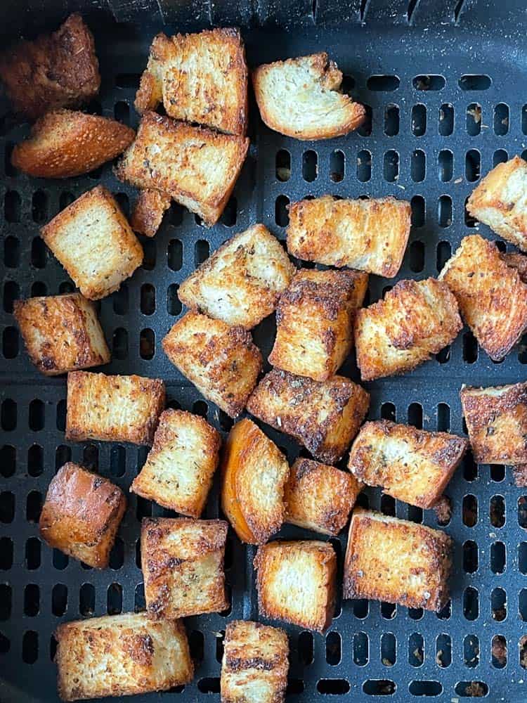 Fresh air fryer croutons still in the basket.