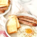 Pin graphinc for air fryer breakfast sausages with sausage, toast and egg.
