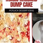 A rectangular baking dish filled with golden Rhubarb Dump Cake sits next to a metal serving spoon and a bowl of whipped cream.