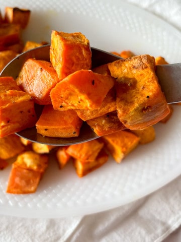 A spoonful of Air Fryer Roasted Sweet Potatoes.