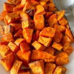 A platter of cooked sweet potatoes.