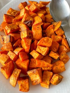 A platter of cooked sweet potatoes.