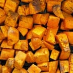 Finished sweet potatoes in the air fryer basket.
