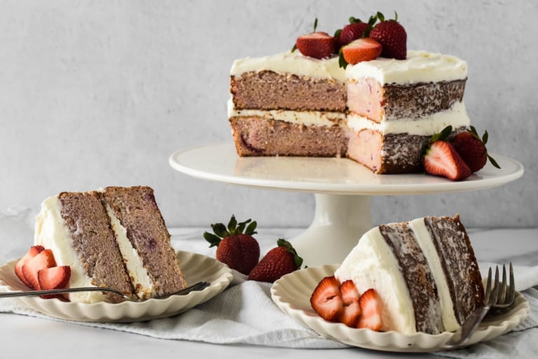 Pink cake without food dye cut and served on plates.