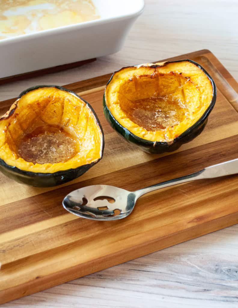 Roasted Acorn Squash on a serving board.