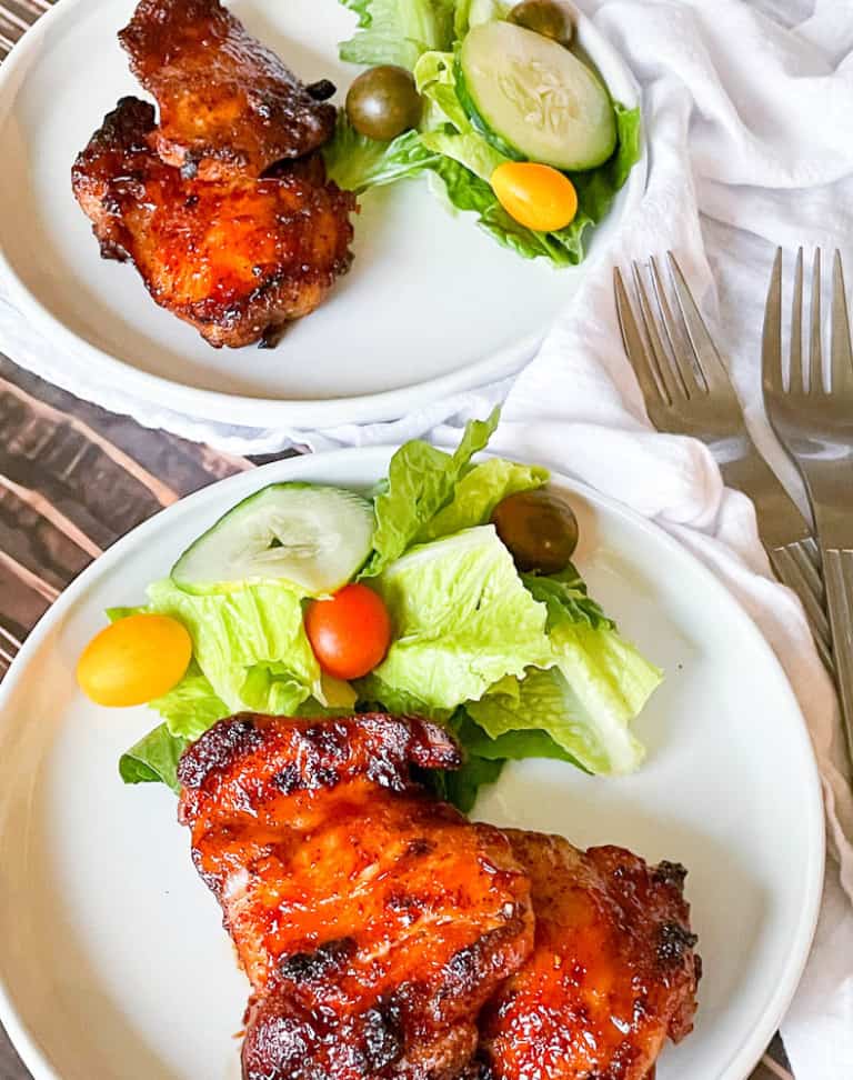 BBQ chicken made in the air fryer with a garden salad.