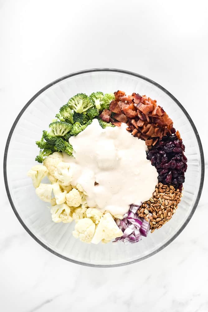 Salad dressing on top of the salad ingredients. 