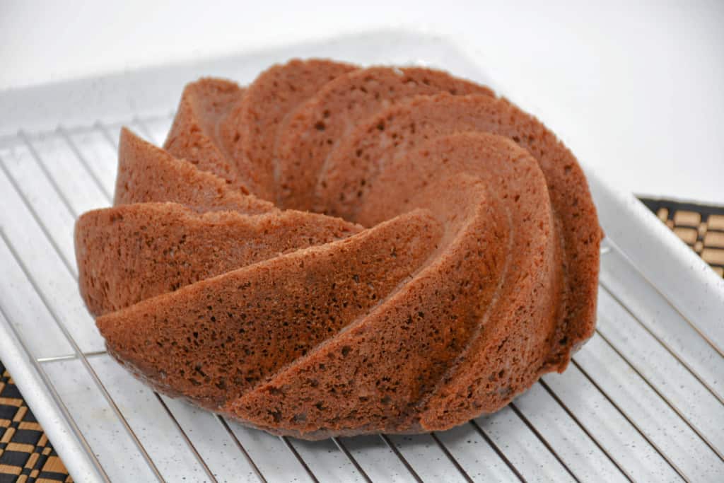 Chocolate Bundt Cake Cooling on a rack.
