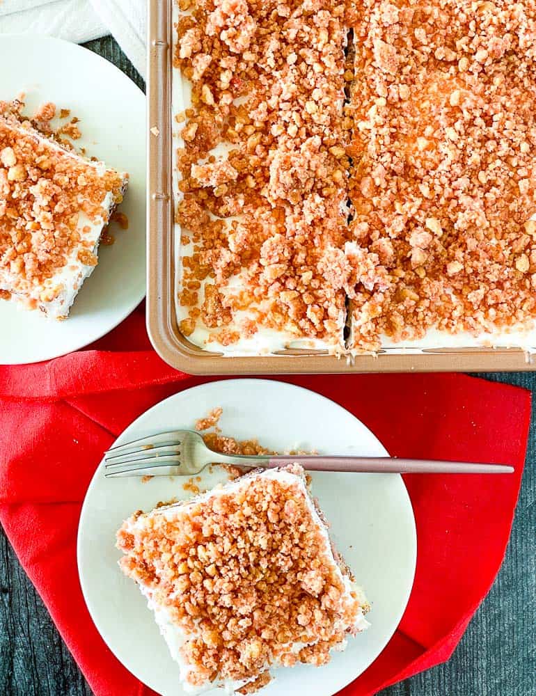 Strawberry crunch cake on plates and in the pan.