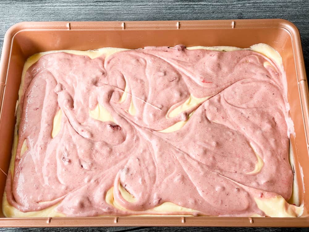 Unbaked strawberry swirl cake.