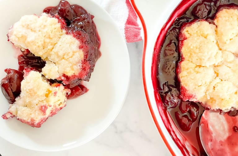 A serving of a fruity summer dessert on a small plate.