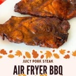 Two cooked pork steaks coated in BBQ sauce sit on a white plate, with text promoting air fryer pork steak, surrounded by autumn leaves graphics.