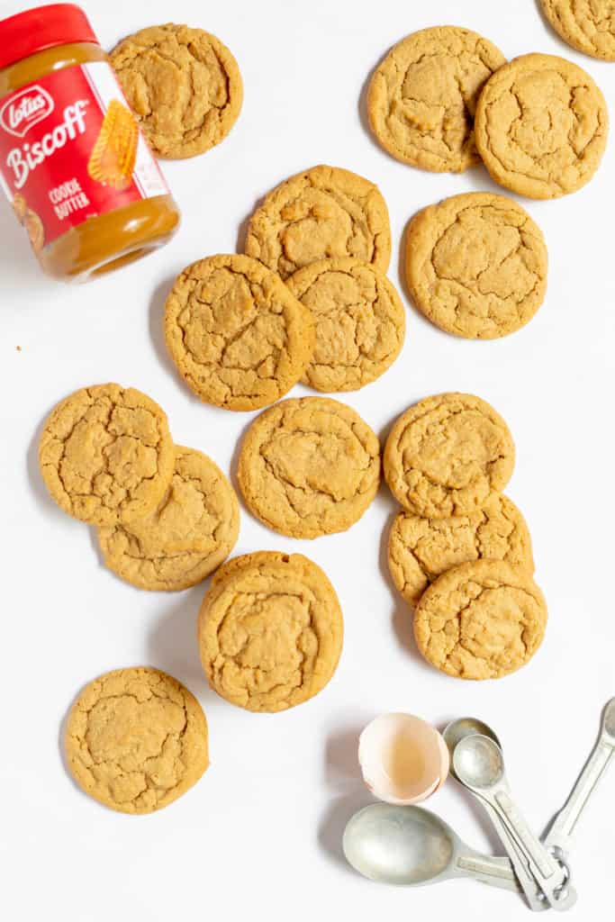 Cookie Butter Cookies with a jar of biscoff and measuring spoons. 