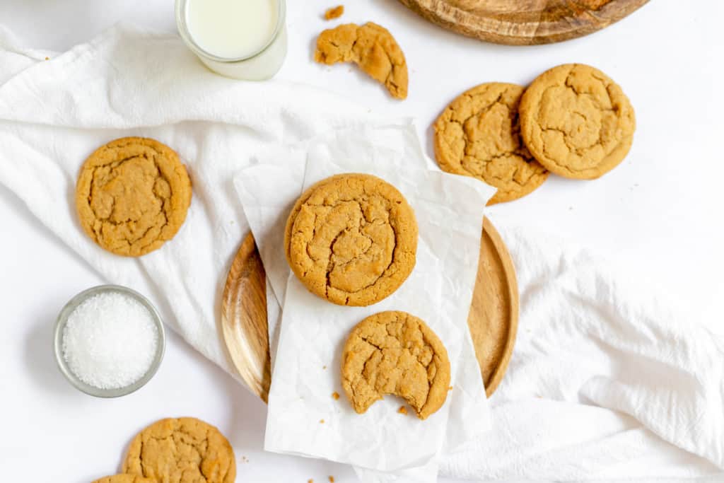 Biscoff cookie butter cookies one has a bite taken out it.