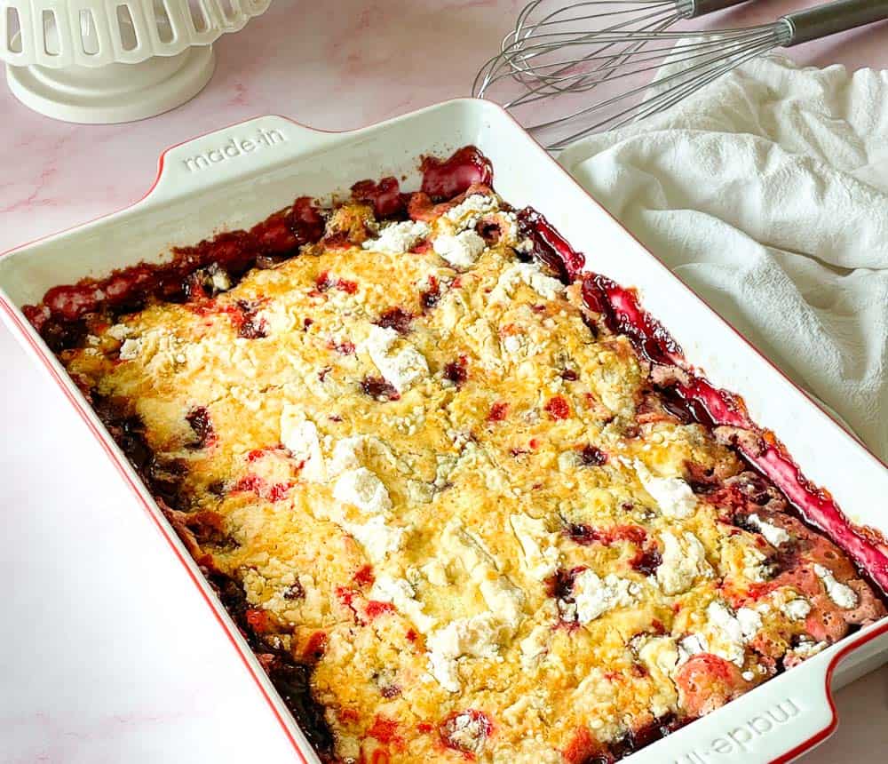 Cherry dump cake in a baking dish.
